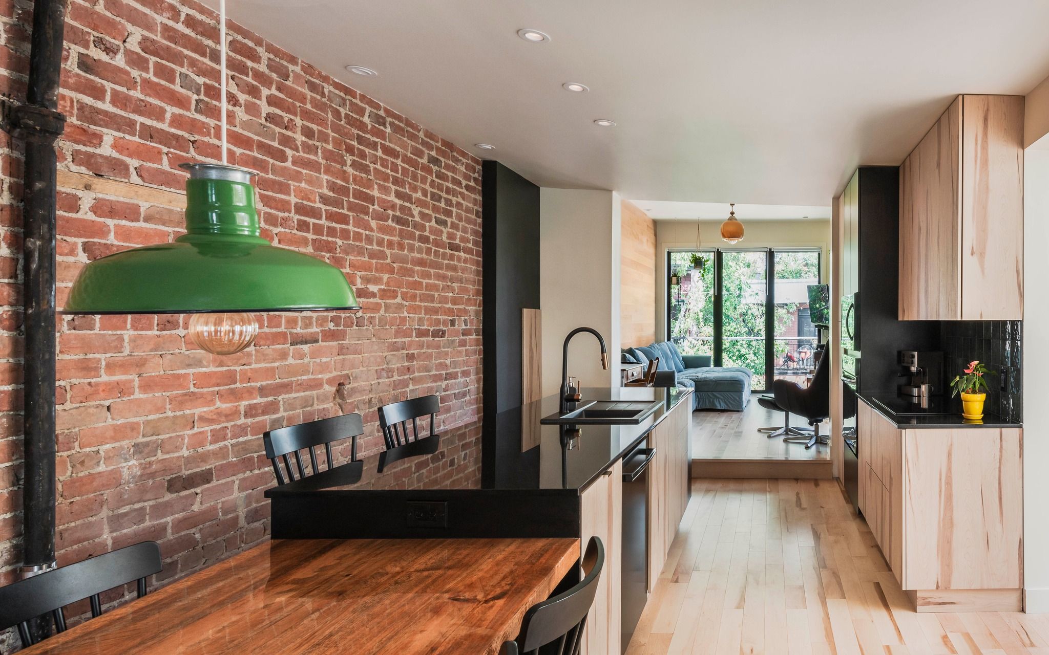 A renovated open-plan kitchen with exposed brick - the kind of home project Billdr connects to vetted contractors.